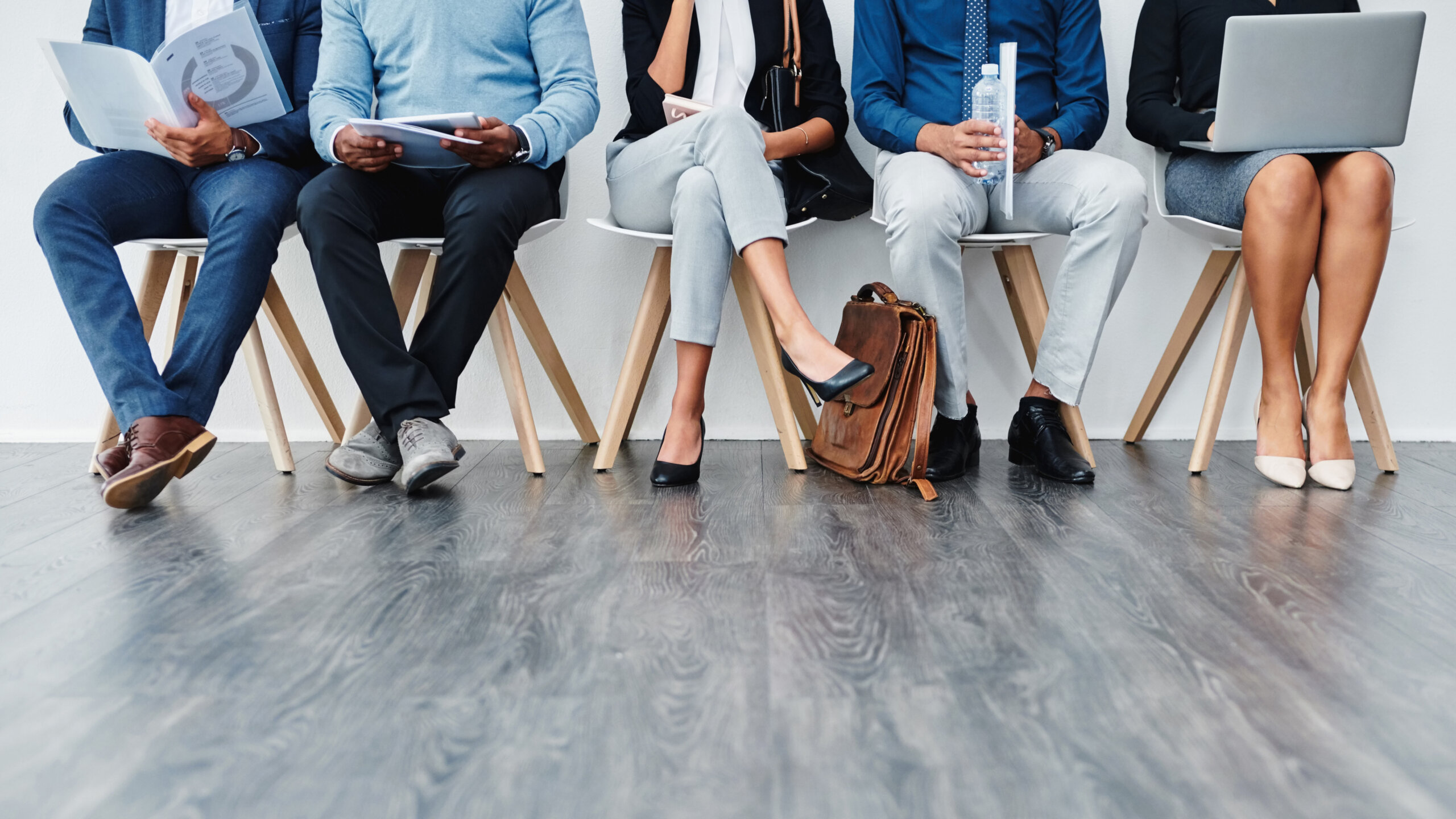 Job applicants sitting in chairs.