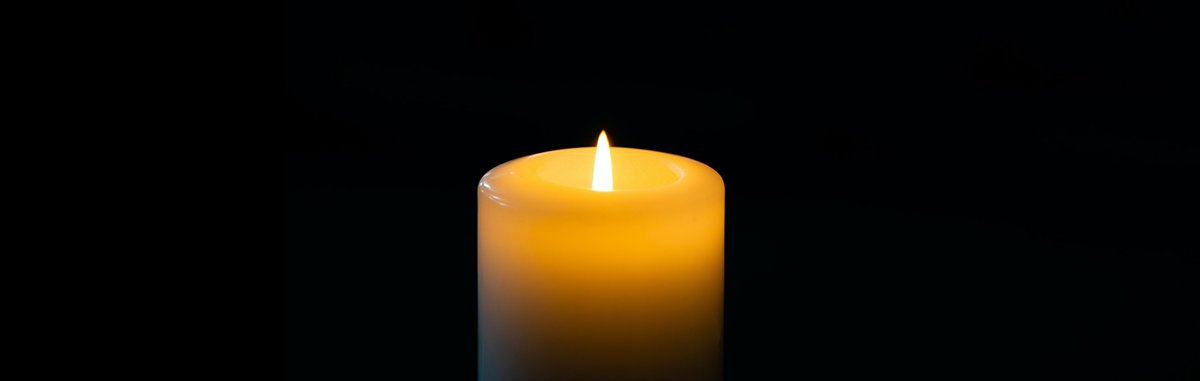 Candle burning in the dark. Image credit: Volodymyr Hryshchenko